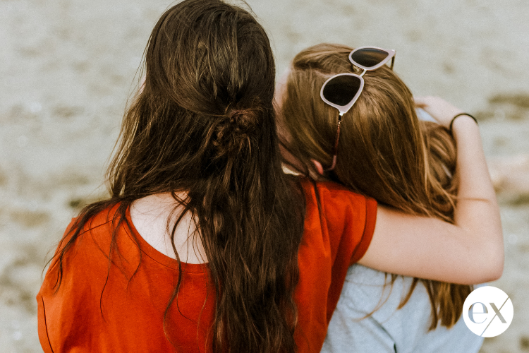 woman-hugging-another-woman-in-support