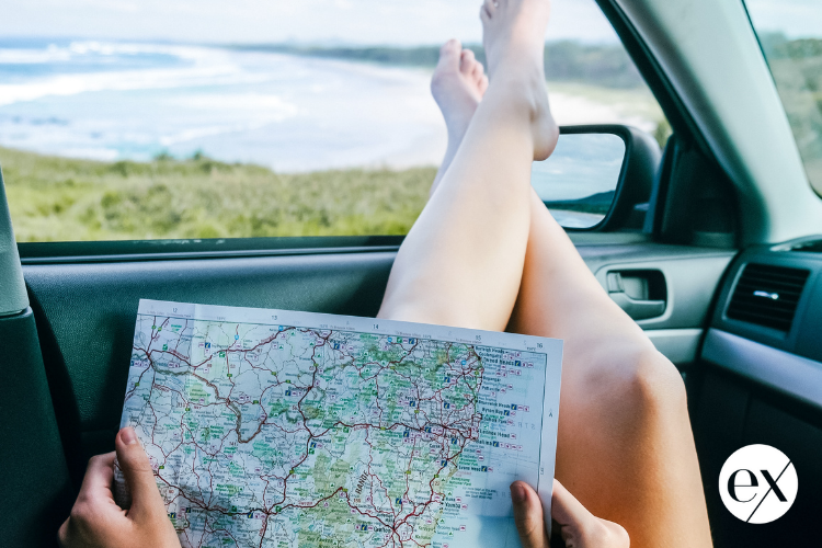 reading-map-in-car-traveling-alone-after-divorce